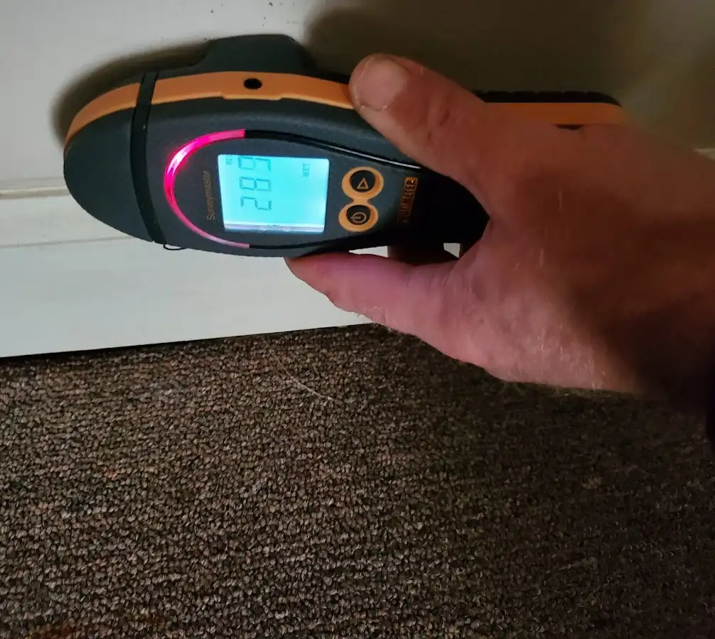 Moisture detection at baseboard during Burst Pipe Cleanup in Atlanta